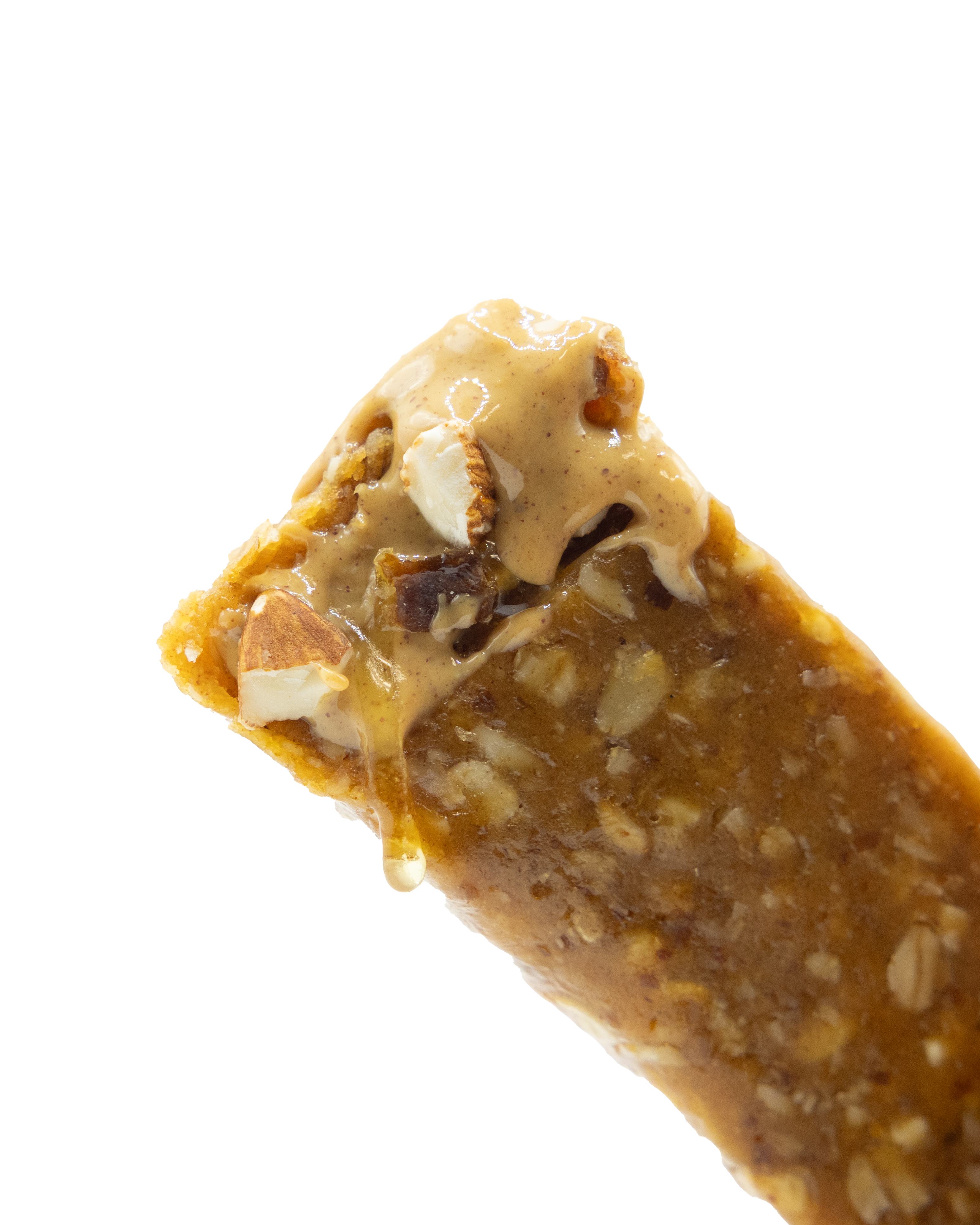 Close-up of a peanut butter protein bar with visible nuts on a white background